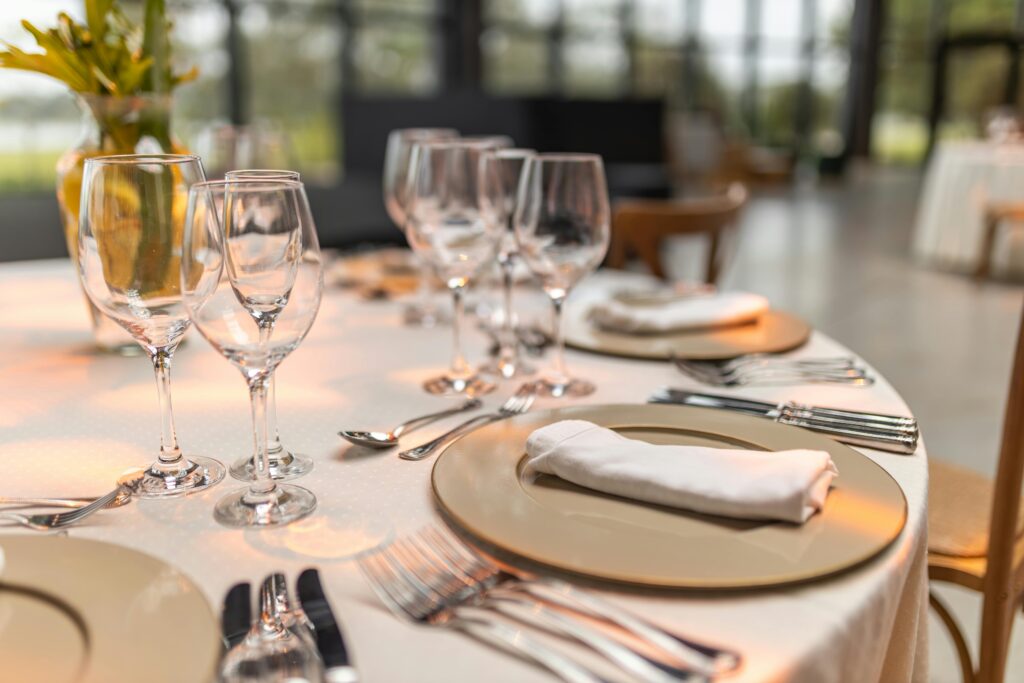 Sophisticated table setup with glassware and napkins for fine dining experience.